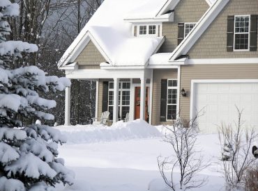 Suburban Home With Snow on Roof - K-Guard Heartland