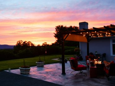 a-family-enjoying-a-sunset-while-relaxing-around-a-2022-11-14-03-30-01-utc