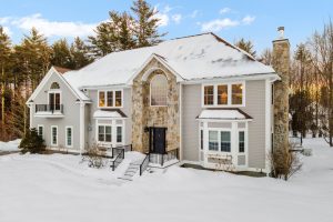 A,Modern,Two-story,House,On,Snowy,Winter,Landscapewith,Trees,In