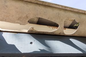 Damaged,Gutters,After,A,Hail,Storm,With,Holes,And,Impact