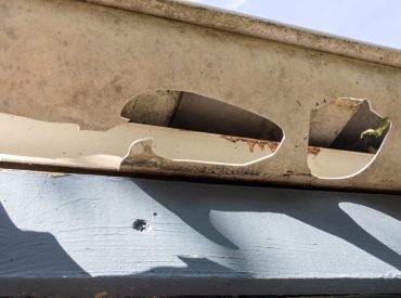 Damaged,Gutters,After,A,Hail,Storm,With,Holes,And,Impact