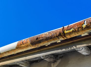 A,Broken,Gutter,On,The,Roof,Of,A,House A,Broken,Gutter,On,The,Roof,Of,A,House